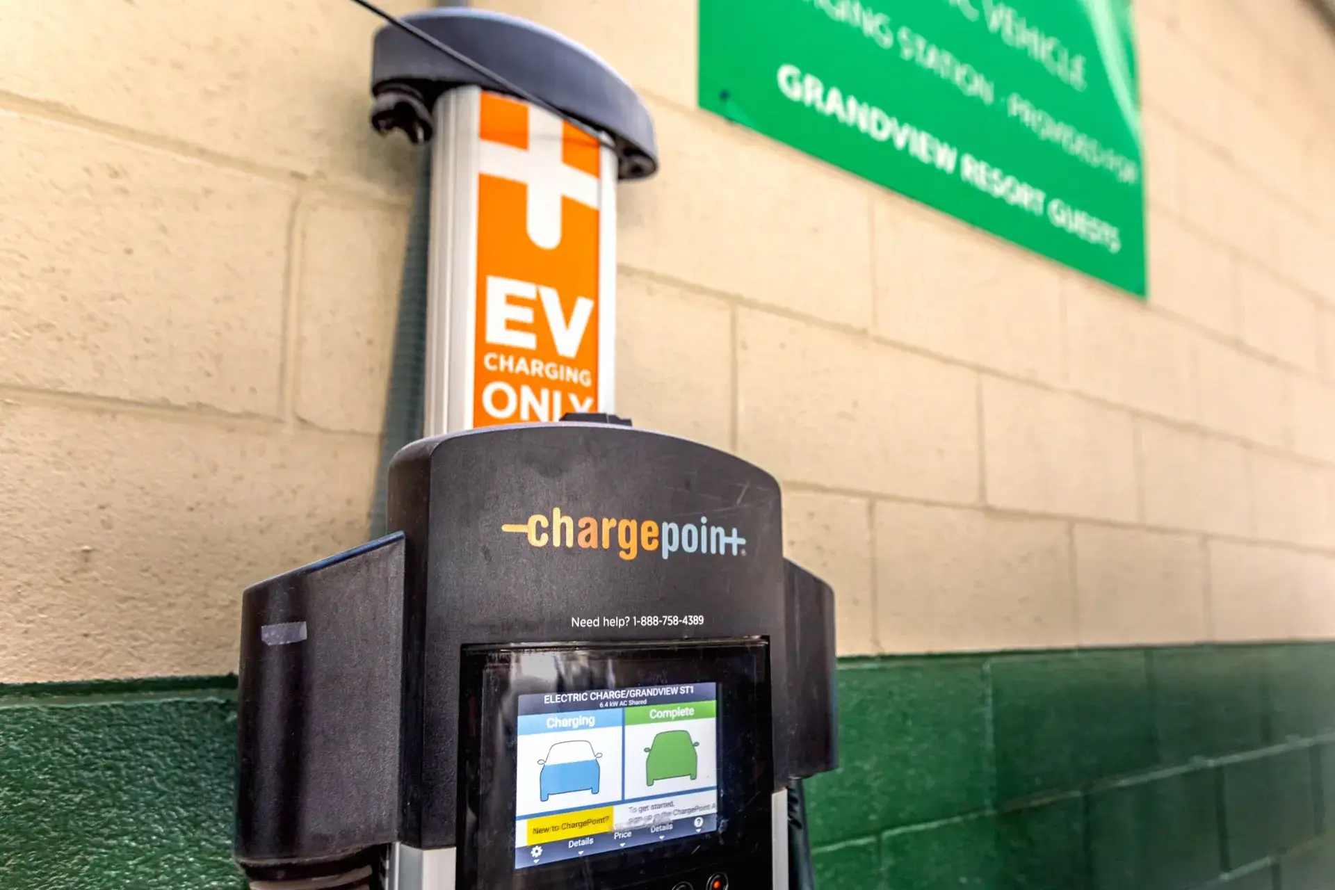 Electric vehicle charging station in the parking garage