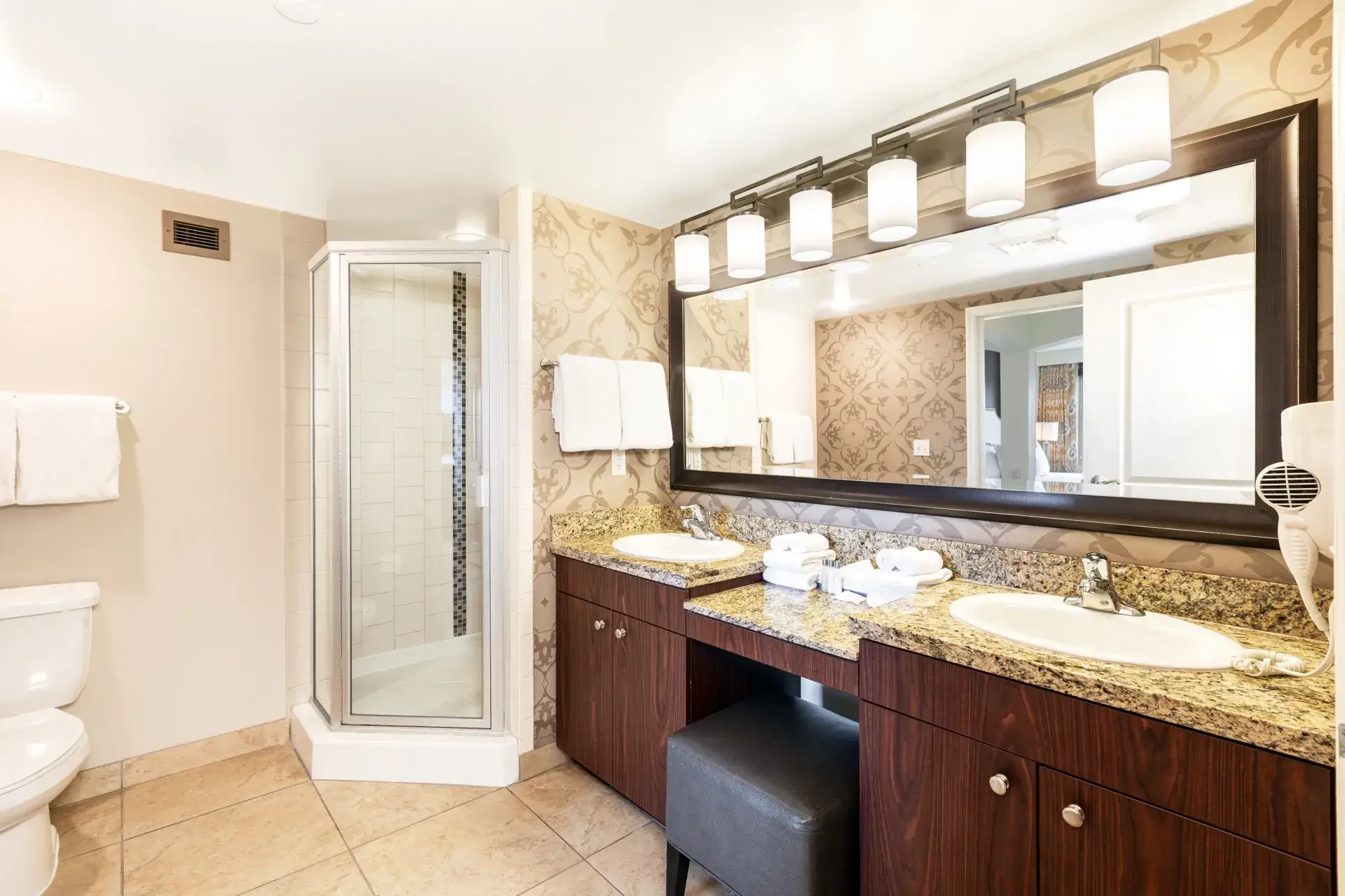 Primary bathroom with double sink vanity and walk-in shower